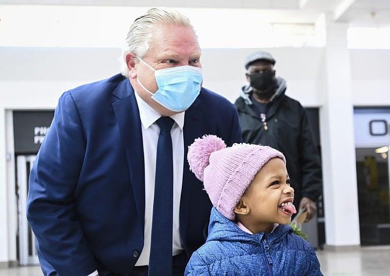 Ford poses for a photograph as he tours the Wellfort Community Health Services in Mississauga, Ont., on Feb. 9, 2021 (CP/Nathan Denette)