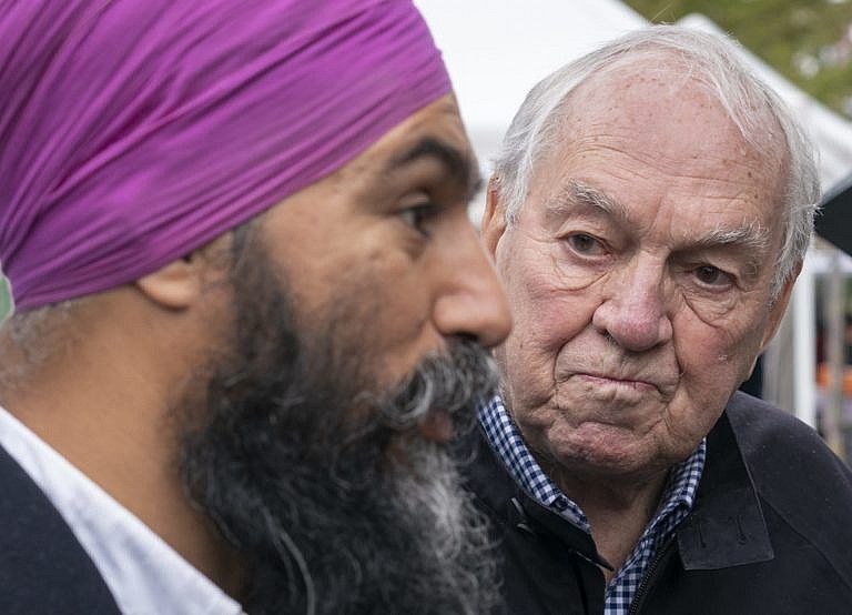 Broadbent listens to NDP leader Jagmeet Singh as they tour a farmers market in Ottawa, on Oct. 6, 2019 (CP/Paul Chiasson)