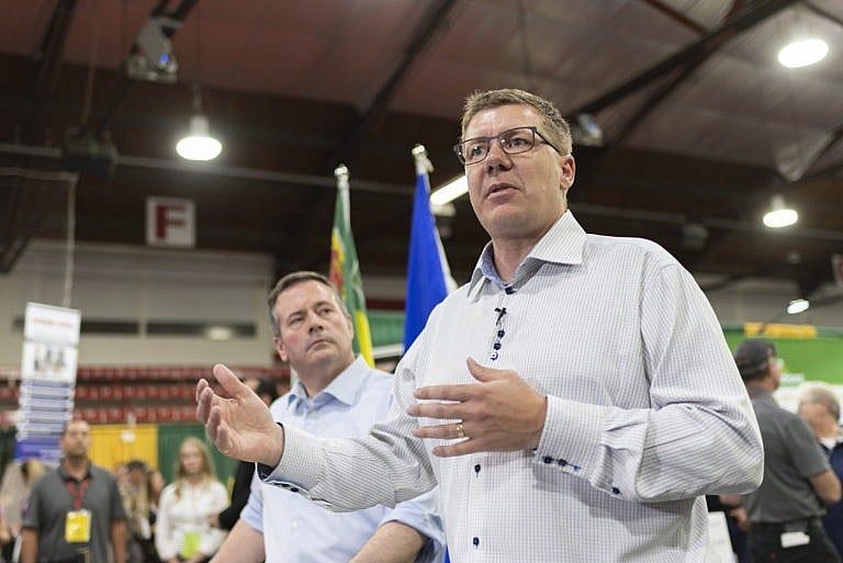 Kenney and Moe speak during a press conference at the Saskatchewan Oil and Gas Show in Weyburn, Sask. on June 5, 2019 (CP/Michael Bell)