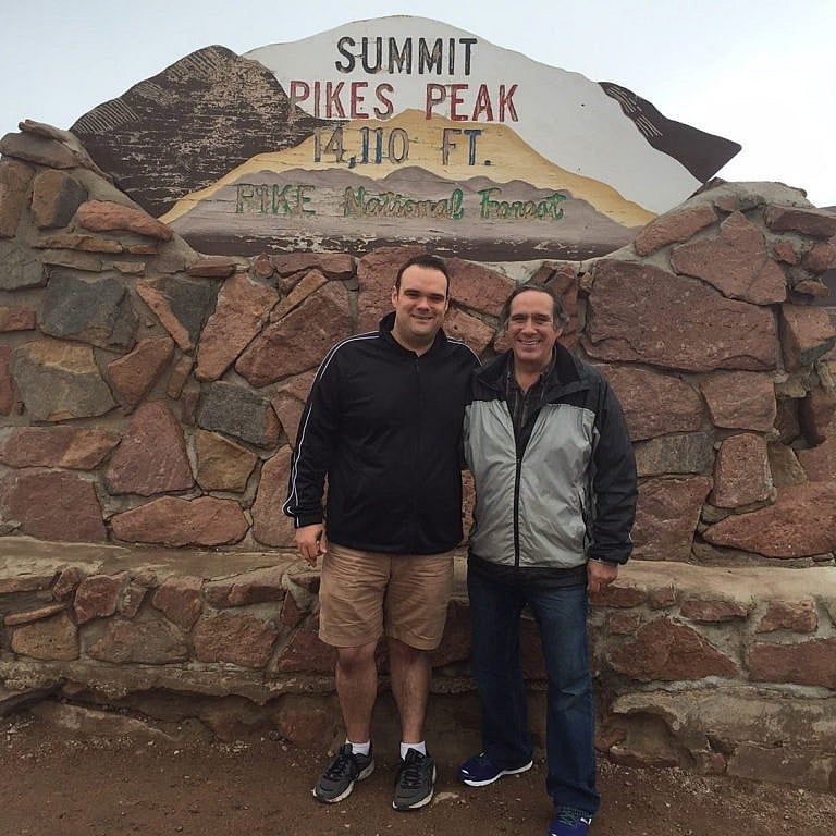 Michael with his dad, Steve, at the summit of Pike National Forest, Colorado (Courtesy of Michael Gunther)