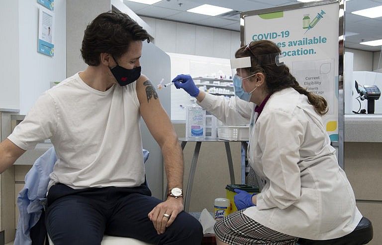 Prime Minister Justin Trudeau receives his COVID vaccination in Ottawa, Friday April 23, 2021. THE CANADIAN PRESS/Adrian Wyld