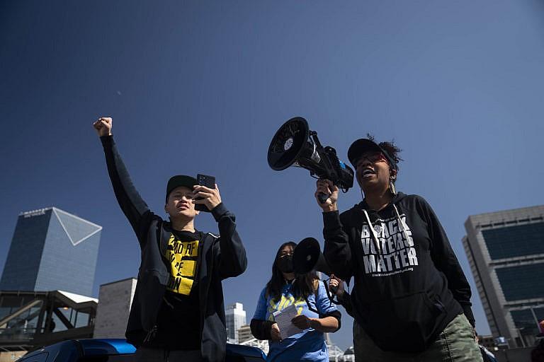 Activist William Lex Ham, left, and Wanda Mosley, Senior Coordinator in Georgia at Black Voters Matter, speak at a Stop AAPI Hate Rally in Atlanta, Georgia, U.S., on Saturday, March 20, 2021. Stop AAPI Hate, a group that tracks anti-Asian violence, said it had received nearly 3,800 reports of hate incidents since mid March, 2020, around the time that the Covid-19 pandemic seized the U.S. More than 500 of those came in the first two months of 2021. (Nicole Craine/Bloomberg/Getty Images)