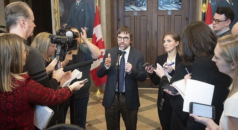 Guilbeault speaks with the media in the foyer of the House of Commons on Feb. 3, 2020 (CP/Adrian Wyld)