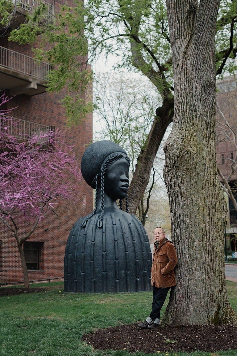 Lum with Simone Leigh’s sculpture Brick House on campus at the University of Pennsylvania (Photograph by Hannah Yoon)
