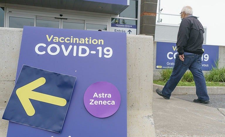 A man arrives at a COVID-19 vaccination clinic in Montreal, on Tuesday, June 1, 2021. THE CANADIAN PRESS/Paul Chiasson