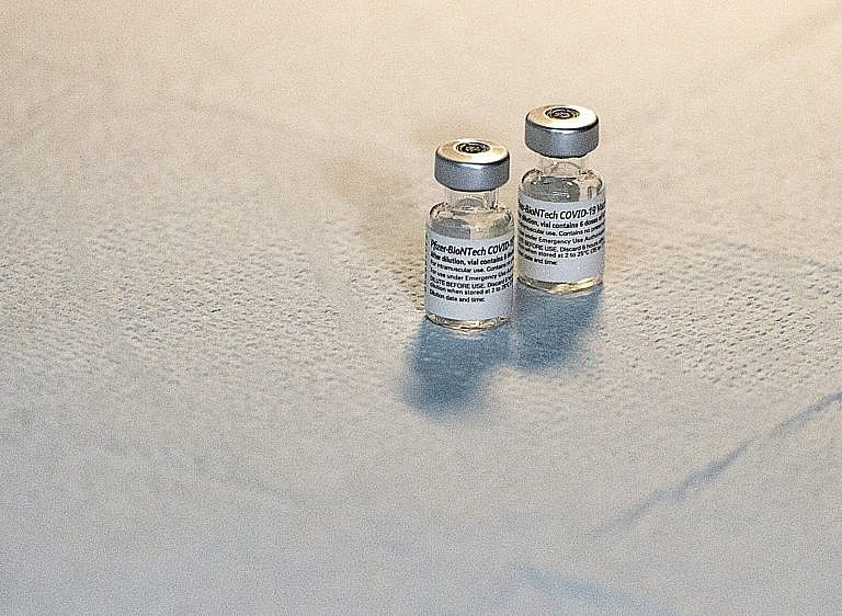 Two vials of the Pfizer-BioNTech vaccine sit on a table at a COVID-19 vaccination clinic in Halifax on Monday, May 24, 2021. THE CANADIAN PRESS/Andrew Vaughan
