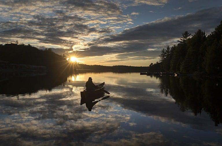 A paddler heads out in Algonquin Park on June 11, 2021 (Fred Thornhill/CP)