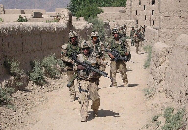 Canadian troops patrol the Afghan village of Zangadin on June 14, 2006 (John Cotter/CP)
