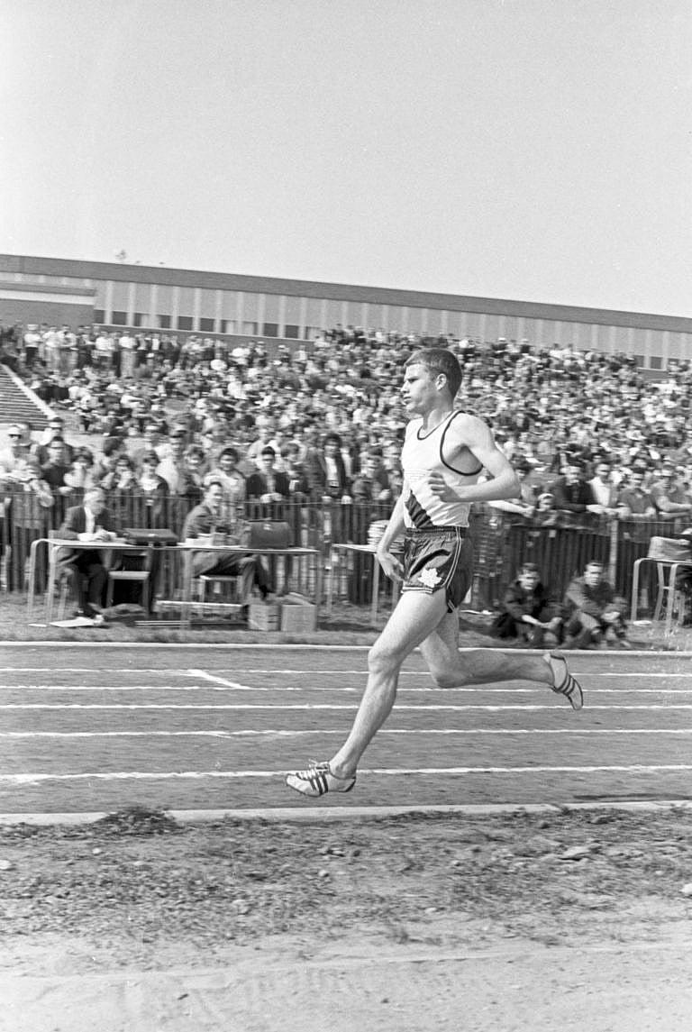 1963. Track and Field Meet in Ancaster, Ontario, May 25, 1963. View of Bruce Kidd competing in race. Photo by Boris Spremo / The Globe and Mail. Neg. #63145-25