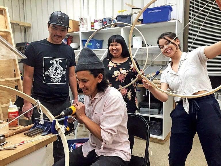 NS students make their own drums, assisted by artist-in-residence Alex Angnaluak (seated)(Courtesy of Courtesy of Nunavut Sivuniksavut)