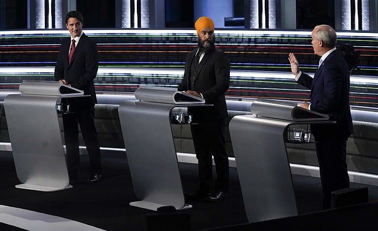 Trudeau, Singh and O'Toole take part in the federal election English-language leaders debate in Gatineau, Que., on Sept. 9, 2021 (Adrian Wyld/CP)
