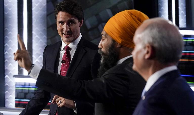 Trudeau, Singh, and O'Toole take part in the federal election English-language Leaders debate in Gatineau, Que., on Sept. 9, 2021 (Adrian Wyld/CP)