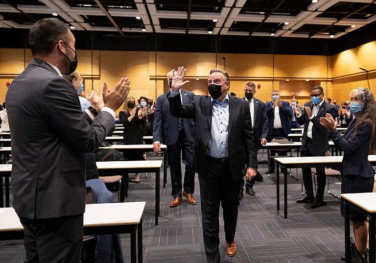 Legault waves to his caucus at the beginning of a pre-session caucus meeting on Sept. 8, 2021 in Quebec City (Jacques Boissinot/CP)