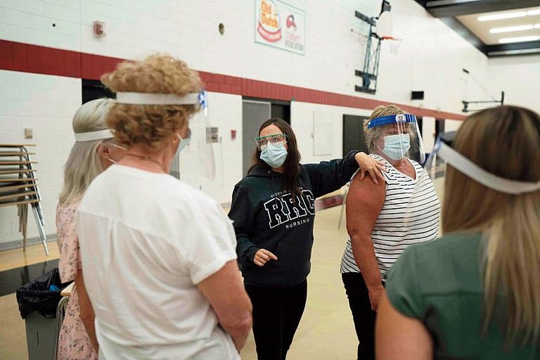 An instructor showing how to vaccinate a patient at Red River College (Photograph by Skye Spence)