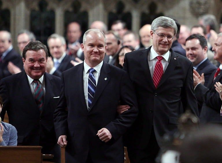 Harper leading Erin O'Toole into the House of Commons in 2012. Thoughout the 2021 campaign, O'Toole seemed happy to leave his former boss on the sidelines. (Fred Chartrand/CP)