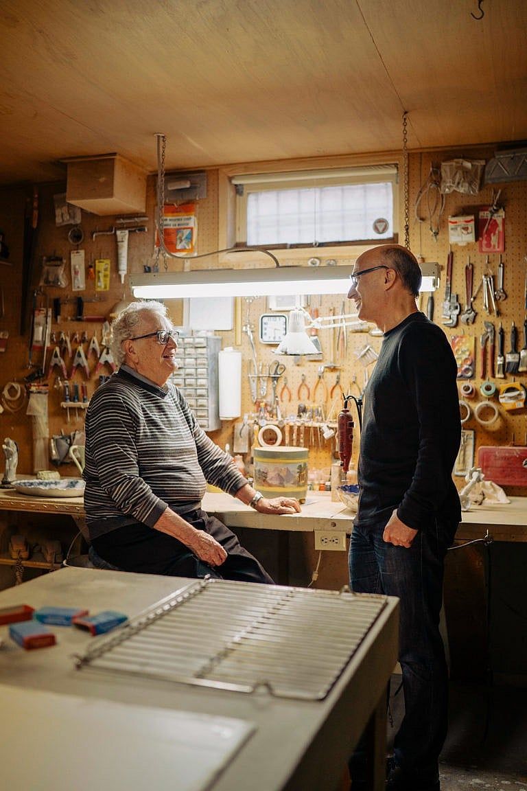 Julius Morry (left) with his son, Jeff, in his longtime basement workshop (Photograph by Skye Spence)