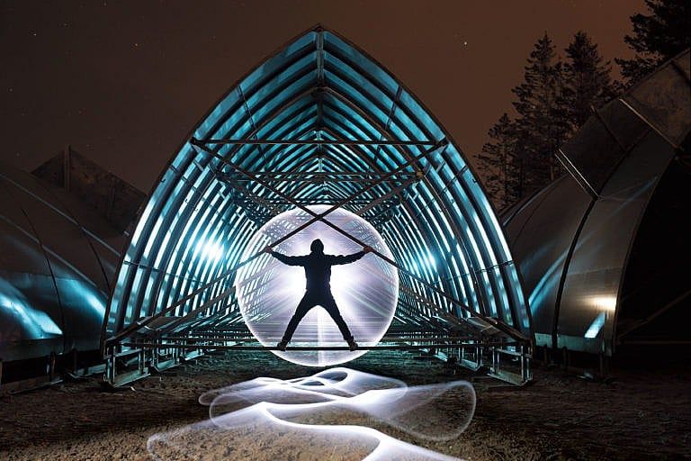 The Hôtel de Glace ice moulds in their Valcartier, QC storage lot, shown in a long exposure image combined with another image that used light painting techniques. (Photo illustration by Roger LeMoyne)