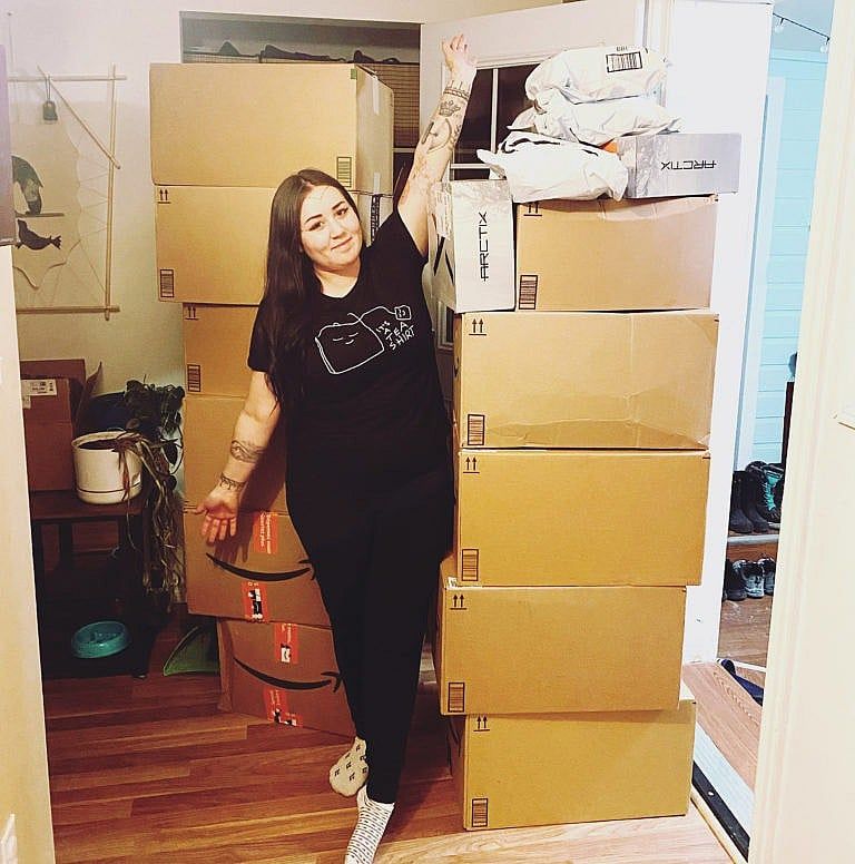 Flaherty, as the boxes of donated food and essentials piled up in her home. (Courtesy of Kyra Flaherty)