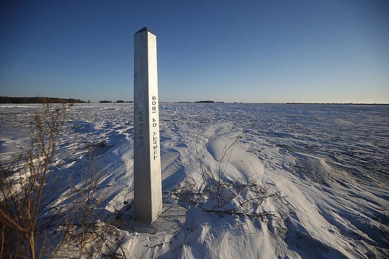 A border marker is shown just outside of Emerson, Man. on Jan. 20, 2022. American investigators believe the deaths of four people, including a baby and a teen, whose bodies were found in Manitoba near the United States border are linked to a larger human smuggling operation. (John Woods/The Canadian Press)