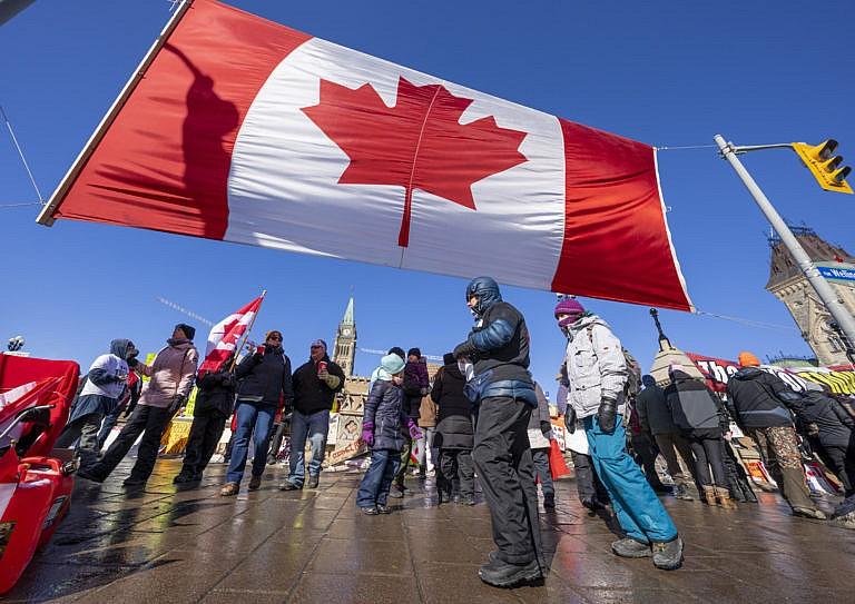 People gather for an anti-mandate protest on Parliament Hill in Ottawa, Feb. 13, 2022. (Frank Gunn/The Canadian Press)
