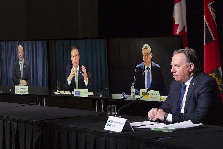 Legault chairs a premiers news conference as premiers John Horgan, Kenney, and Scott Moe appear onscreen, on March 4, 2021 in Montreal (Ryan Remiorz/CP)