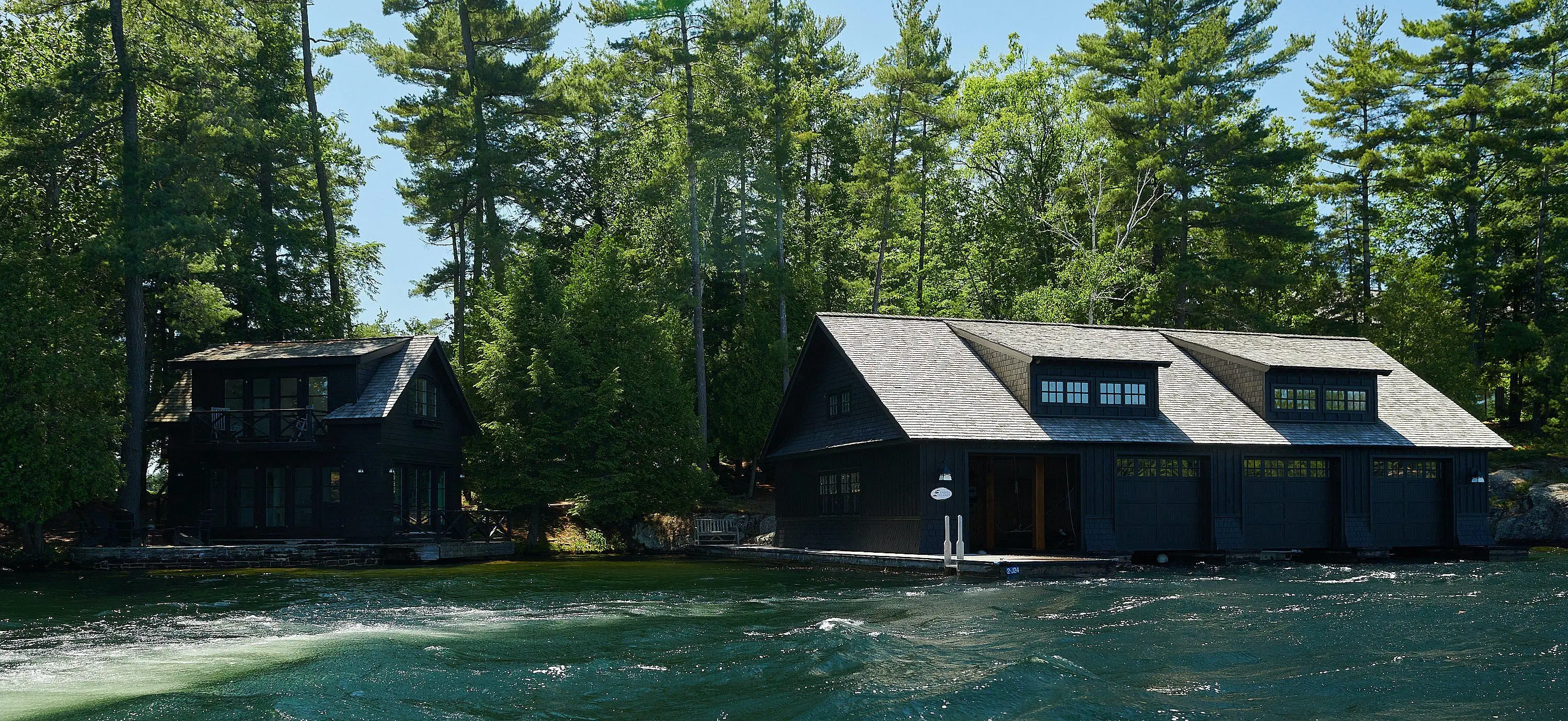 Oatley's stately cottage is nestled on an island in Lake Joseph, across from Sugarloaf. He boats by Azouri's construction zone on his way to and from the mainland. 