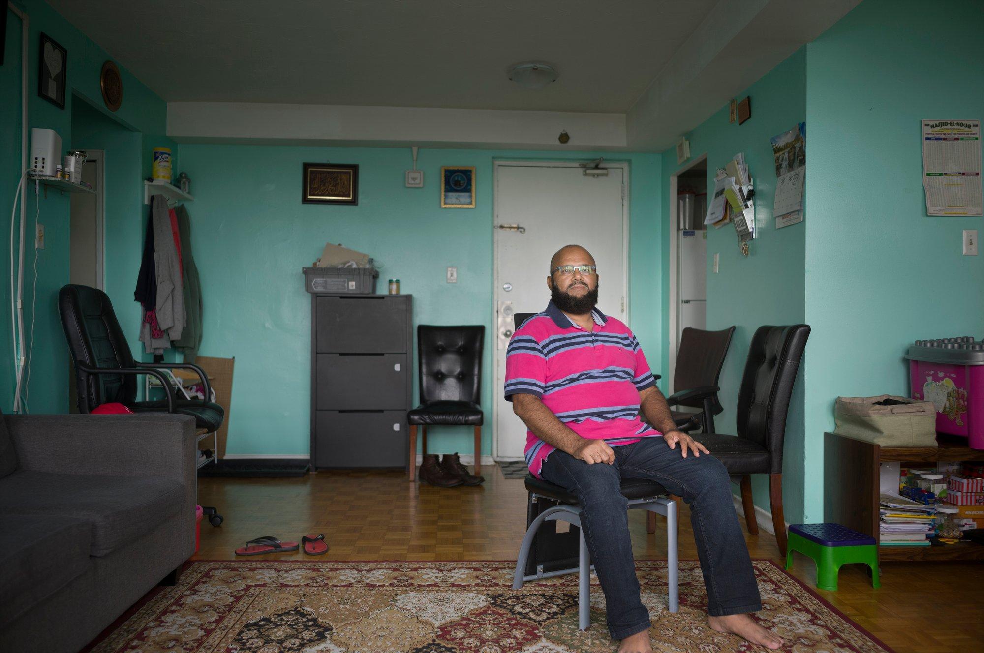 Rashid Limbada, shown here in his apartment, is among the tenants of 1440 and 1444 Lawrence Ave. W. on Toronto who have joined a rent strike. "Maintenance of my unit is at an all-time low, and my family canât afford to leave,â Limbada says. (Photograph by Ian Willms)